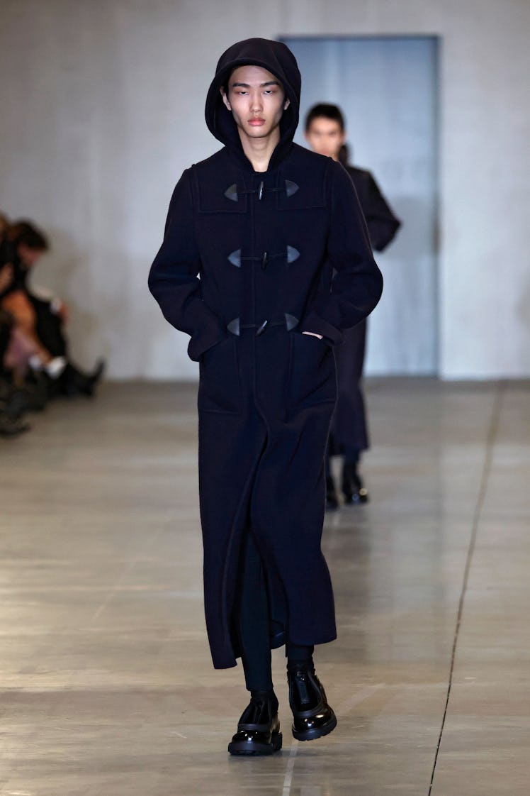 A model walks the runway at the Prada fashion show during the Milan Menswear Fall/Winter 2023/2024 o...