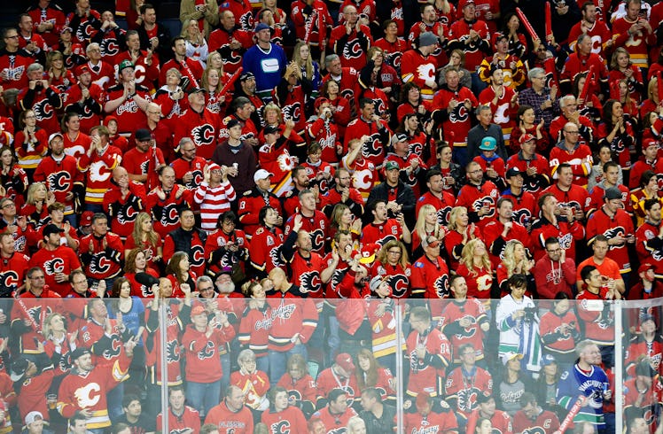 CALGARY, CANADA - APRIL 25: A Calgary Flames fan dressed up as "Where's Waldo" is a sea of red jerse...