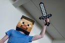 A man dressed as the game character of the computer game Minecraft poses at the MGM Comic Con in Han...