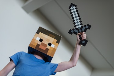 A man dressed as the game character of the computer game Minecraft poses at the MGM Comic Con in Han...