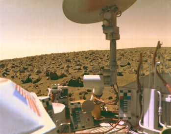 Viking 2 image of Mars Utopian Plain, September 3, 1976. The boulder-strewn field of red rocks reach...