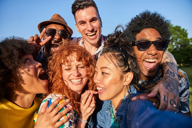 A group of friends pose for a group selfie as they consider their January 23, 2023 weekly horoscope.