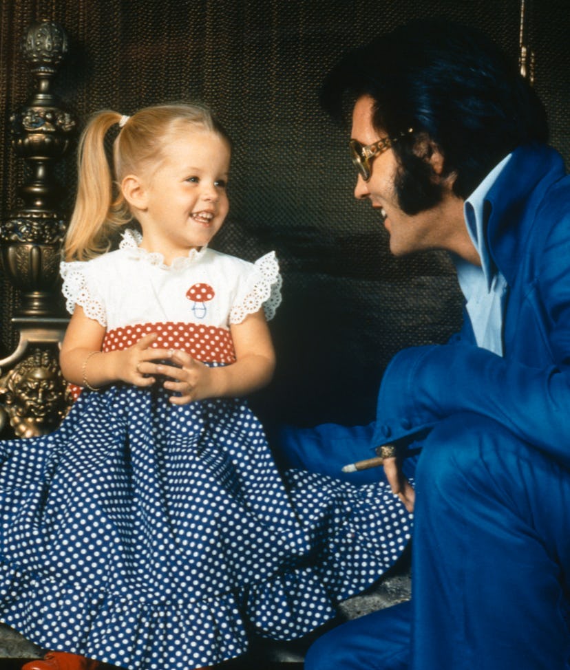 American rock legend Elvis Presley with his daughter Lisa-Marie Presley. (Photo by Frank Carroll/Syg…