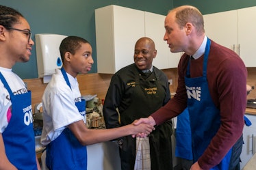 Prince William, Prince of Wales shakes hands with Ramae Bogle 13.