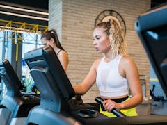 A woman on a treadmill tries walking workouts from TikTok for cardio exercise.