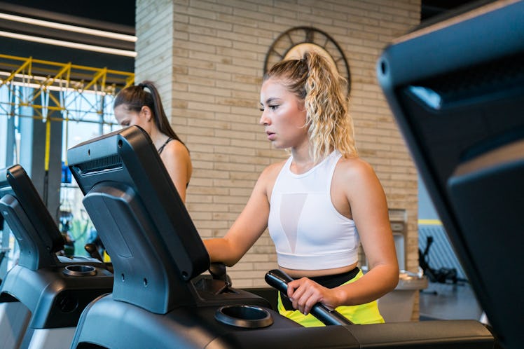 A woman on a treadmill tries walking workouts from TikTok for cardio exercise.