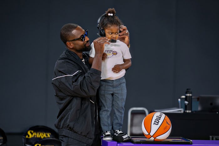 LOS ANGELES, CA - JUNE 30: Kaavia Wade wants no part of a half time interview with her dad Dwayne Wa...