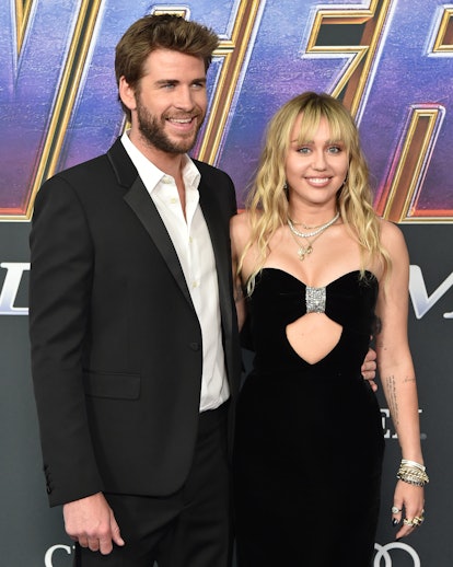 LOS ANGELES, CALIFORNIA - APRIL 22: Liam Hemsworth and Miley Cyrus attend the World Premiere of Walt...