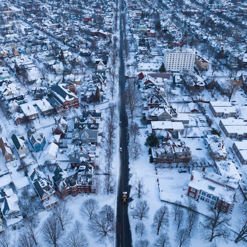 In this aerial photo, an excavator (C, bottom) makes its way up Richmond Avenue in Buffalo, New York...