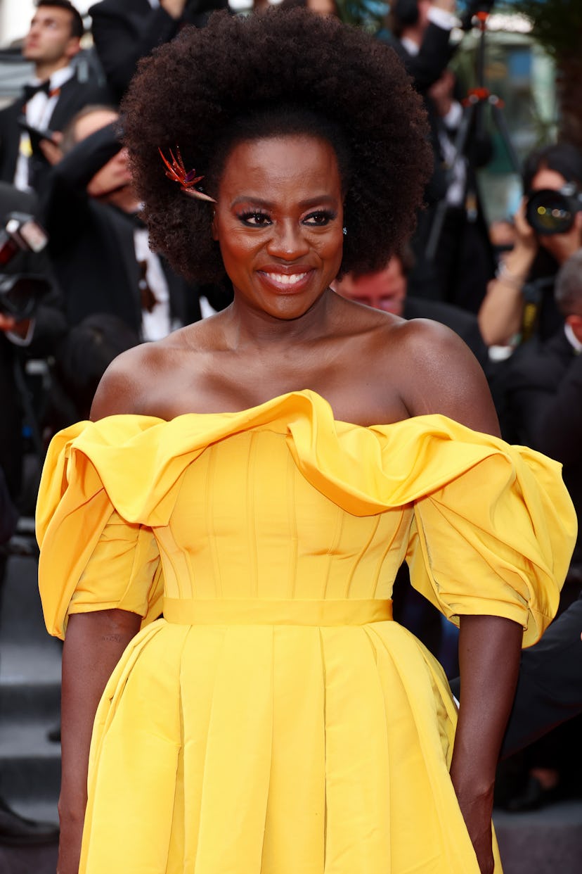 Viola Davis attends the screening of "Top Gun: Maverick" wearing a bright yellow gown