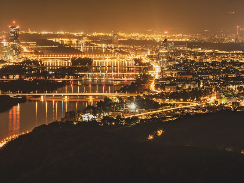 Panorama of Vienna Austria by Night From Above Many Lights and the Danube River Crossing the City Sk...