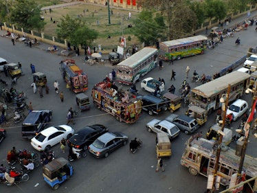 Traffic moving around Empress Market / in the neighborhood of Saddar, Karachi.

Saddar is the commer...