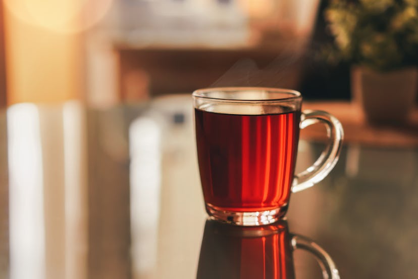 A transparent mug full of red raspberry leaf tea for pregnancy.
