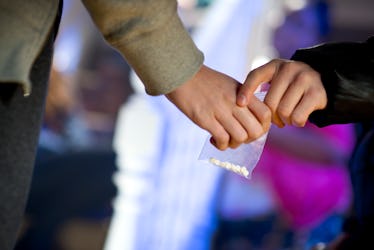 ecstasy being handed over at a house party..