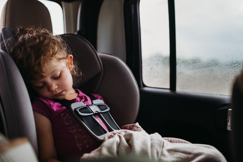 Packing blankets in the car for kids to use in a car seat is a great winter travel tip.