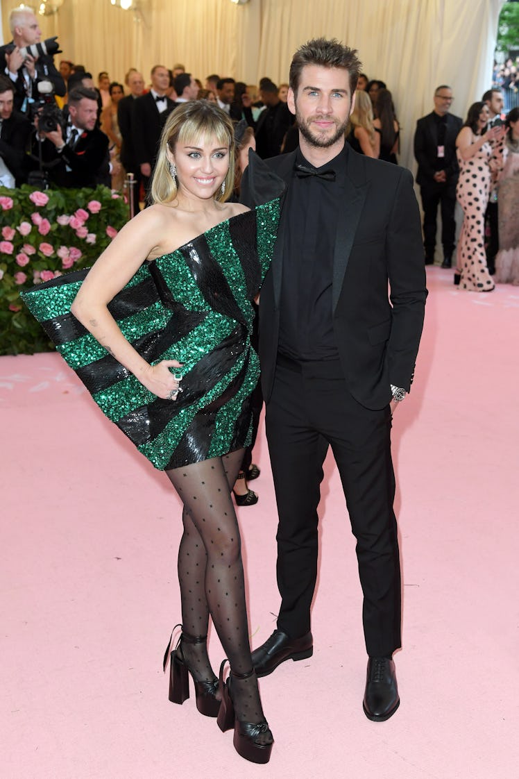 Miley Cyrus and Liam Hemsworth arrive for the 2019 Met Gala celebrating Camp: Notes on Fashion