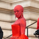 On Jan. 23, Doja Cat made heads turn by appearing at Schiaparelli's fashion show covered in 30,00 cr...