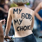 "My body my choice" written on person's back. Instagram and Facebook might finally free the nipple i...