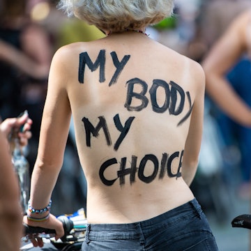 "My body my choice" written on person's back. Instagram and Facebook might finally free the nipple i...