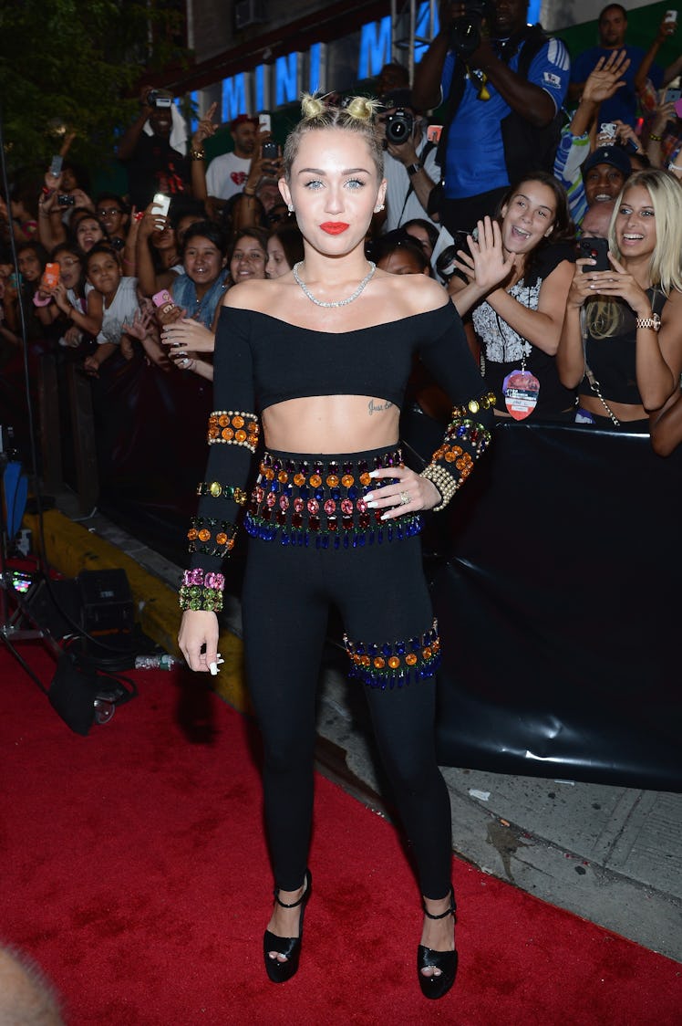  Miley Cyrus (Detail: Dolce & Gabbana, Lorraine Schwarz jewels, Giuseppe Zanotti shoes) attends the ...
