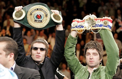 Liam Gallagher and Noel hold up England's Ricky Hatton Belts before defeating USA's Paulie Malignagg...