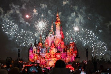 Fireworks and lights illuminate the Enchanted Storybook Castle at the Shanghai Disney Resort after t...