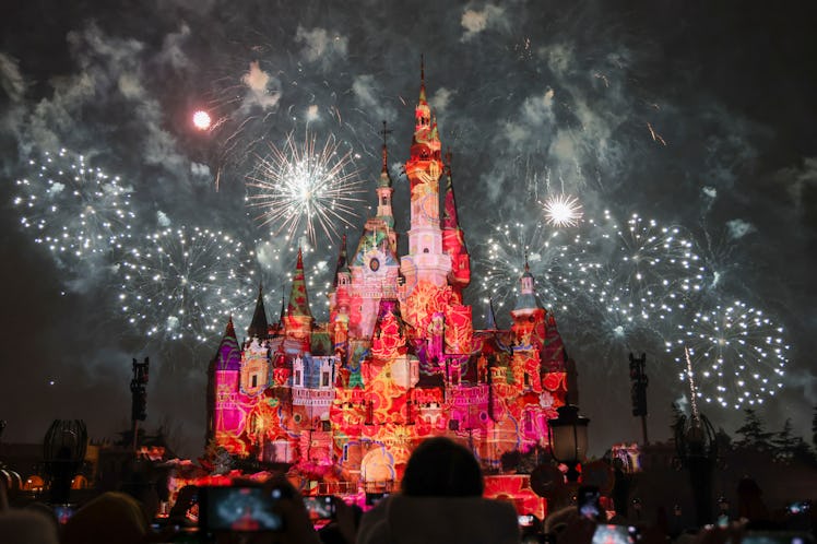 Fireworks and lights illuminate the Enchanted Storybook Castle at the Shanghai Disney Resort after t...