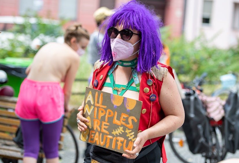 10 July 2021, Berlin: A participant of a bicycle demonstration under the motto "No Nipple is free un...
