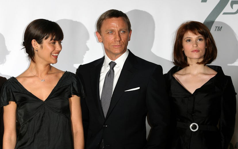 (left-right) Olga Kurylenko, Daniel Craig and Gemma Arterton pose for the media during a photocall t...