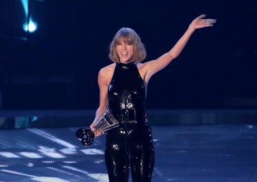 Taylor Swift accepting an Award that is not an Oscar