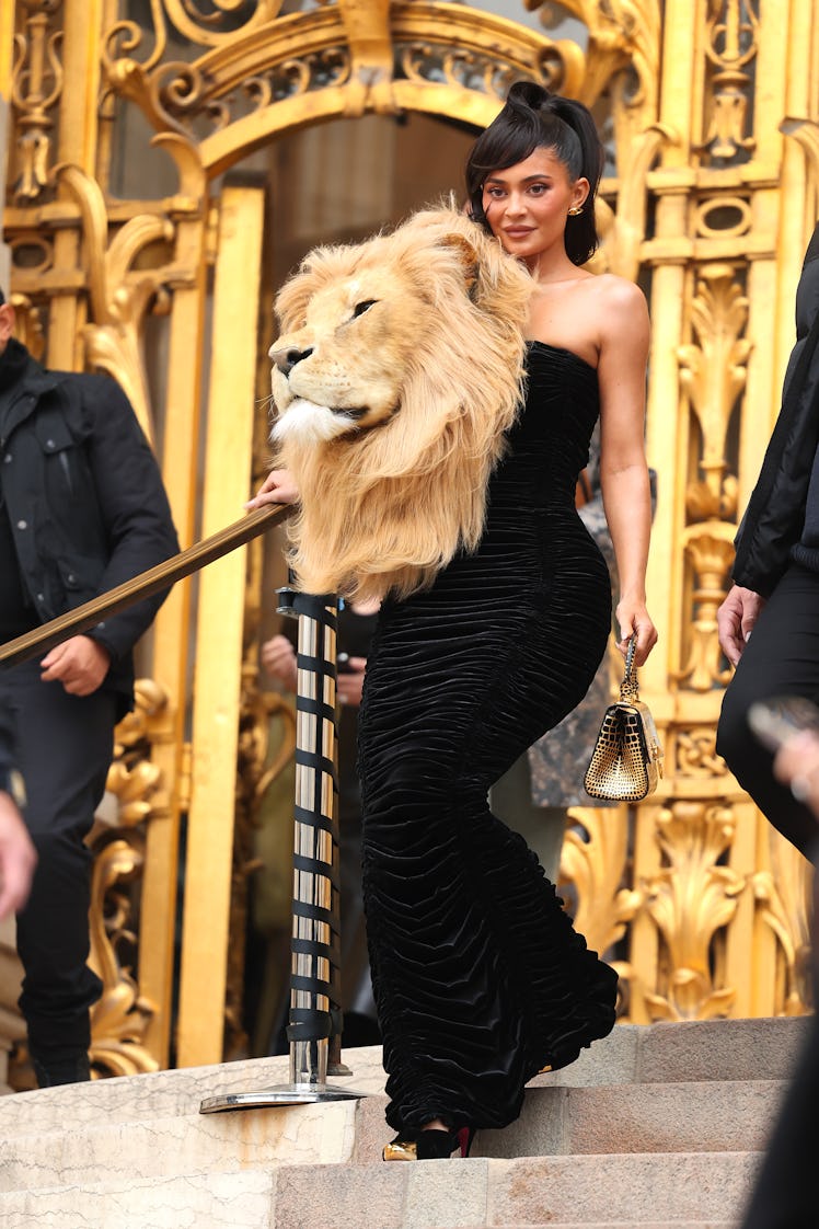 Kylie Jenner wears a dress with a lion's head at the Schiaparelli Haute Couture Spring Summer 2023 s...