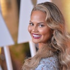 Chrissy Teigen flaunts her post-partum leaky boobs, and we are all here for it. 