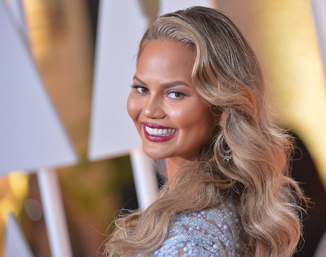 Chrissy Teigen flaunts her post-partum leaky boobs, and we are all here for it.