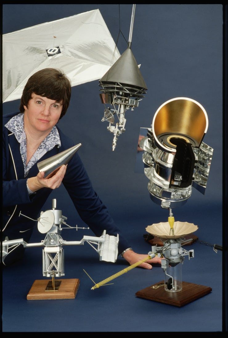 The Jet Propulsion Lab's Donna Pivirotto stands with a collection of models of NASA space probes, in...
