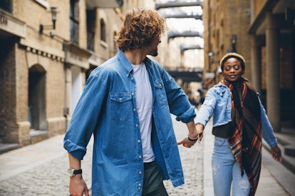 couple walking hand in hand in London to illustrate the concept of soul ties