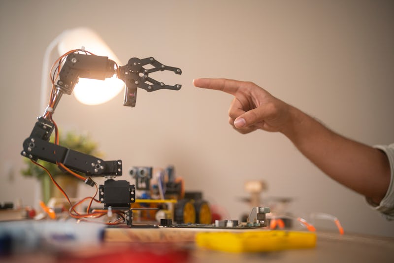 Robot hand touching with human hand