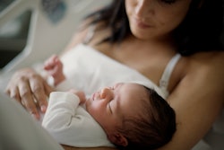 Newborn girl sleeps in her mom arms, why does my newborn shake
