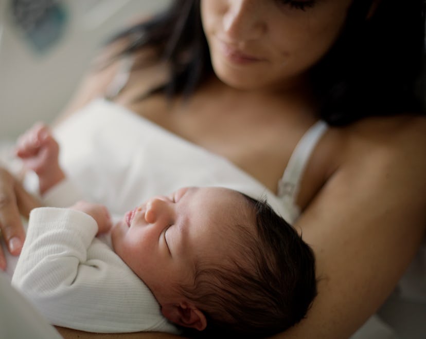 Newborn girl sleeps in her mom arms, why does my newborn shake