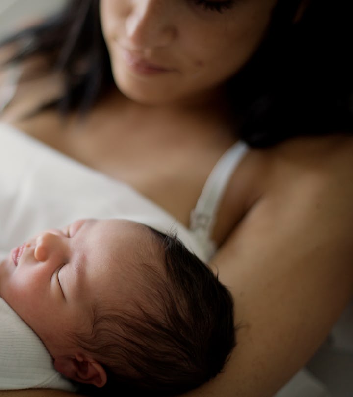 Newborn girl sleeps in her mom arms, why does my newborn shake