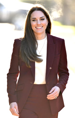 Kate Middleton wearing a burgundy pantsuit by Roland Mouret