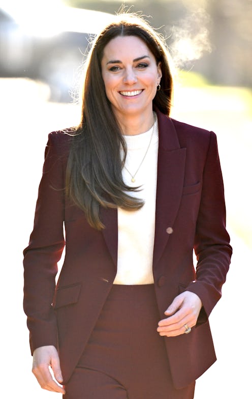 Kate Middleton wearing a burgundy pantsuit by Roland Mouret