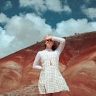 a young woman poses for a photo in the desert, as she considers her january 30, 2023 weekly horoscop...