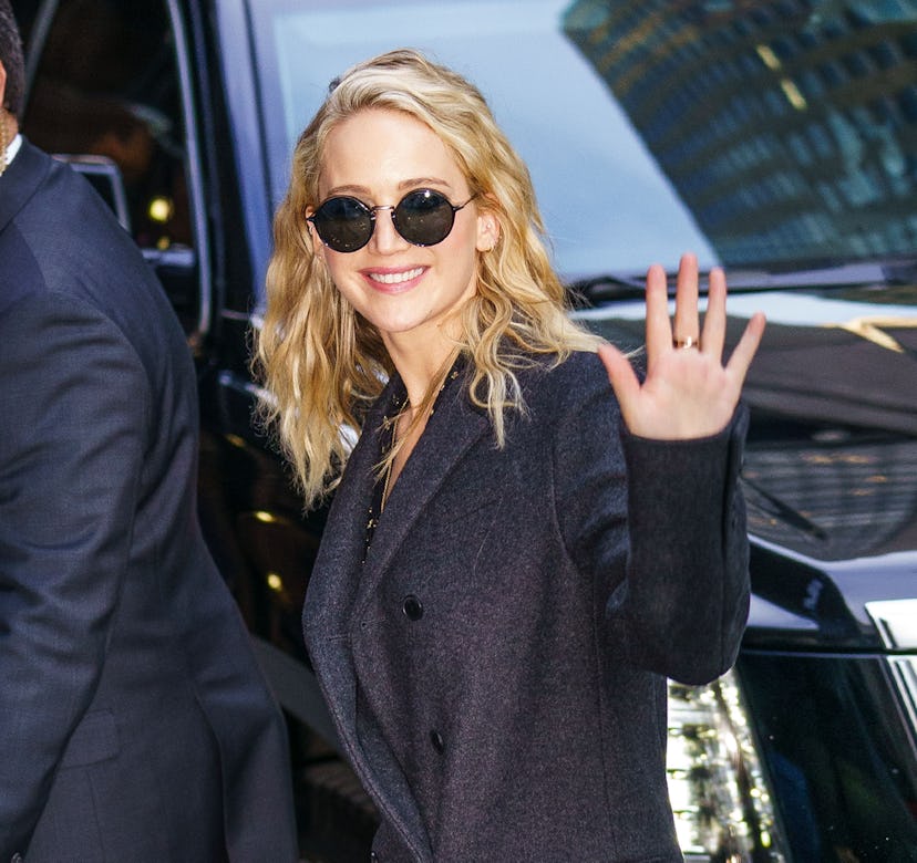 Jennifer Lawrence wearing a gray wool coat.