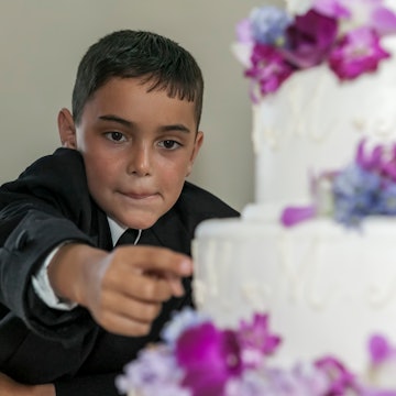 Child steals frosting from wedding cake. A Redditor just asked if they were in the wrong for publicl...