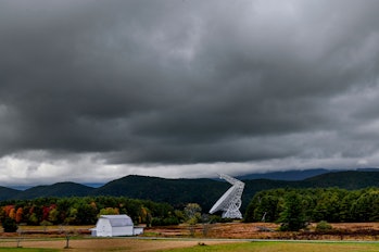 The Green Bank Telescope (R), the largest of eight radiation detecting dishes at the Green Bank Obse...