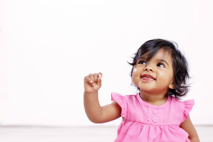 adorable baby girl looking up in list of names that start with z