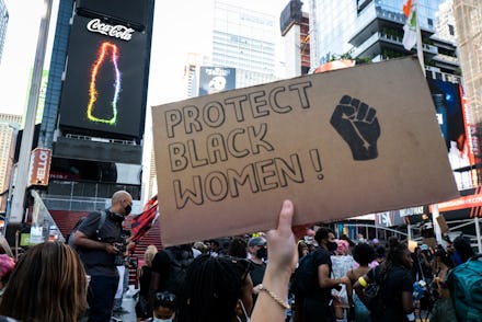 MANHATTAN, NY - July 26: A protester holds a handmade sign that says "Protect Black Women!" with the...