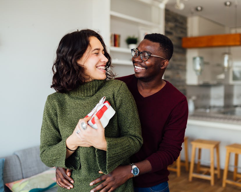 Happy young interracial couple having fun at home for article on best valentine's day gifts for her