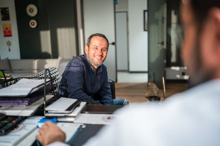 Man talking with doctor at his office