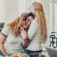 Mother embraces her daughter, mom mentor